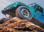 Falken Wildpeak M/T — hero jeep rock