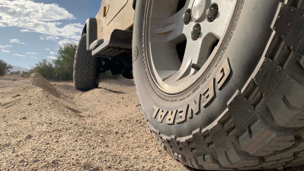 General Grabber A/T X — hero sand action