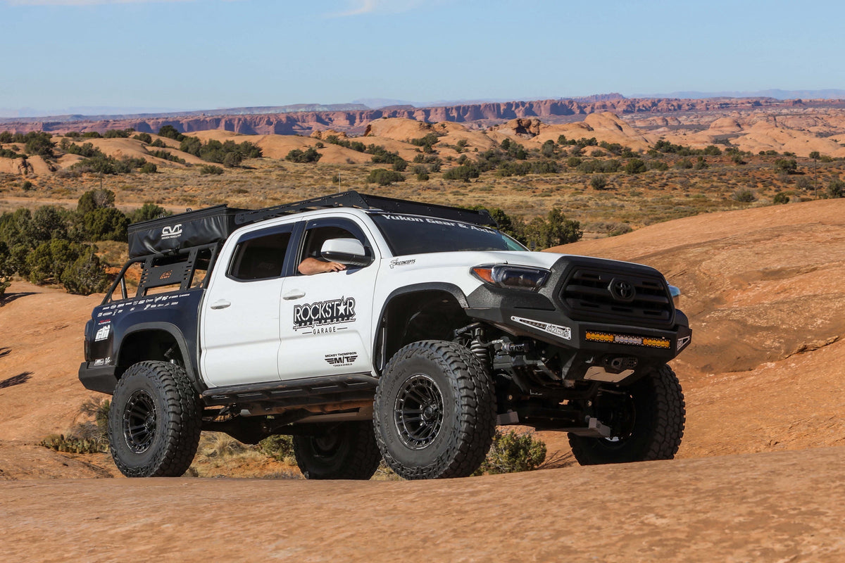 Mickey Thompson Baja Boss A/T — hero tacoma desert