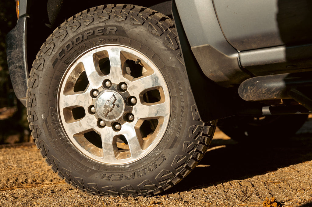 Cooper Discoverer Stronghold A/T — hero mounted dirt