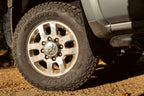 Cooper Discoverer Stronghold A/T — hero mounted dirt