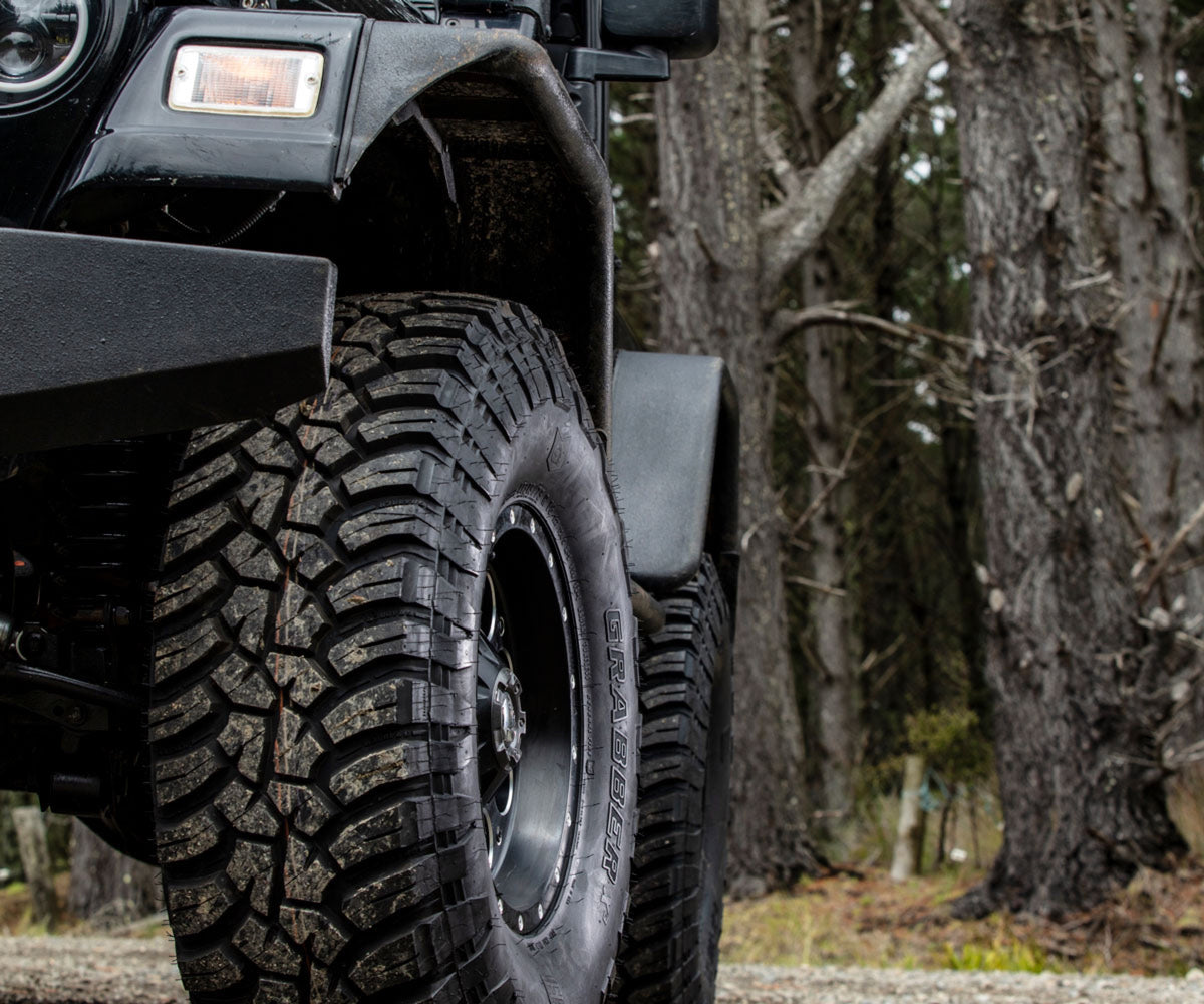 General Grabber X3 — hero jeep forest