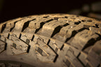 Cooper Discoverer Stronghold A/T — hero tread dirt