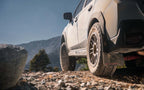 Nitto Nomad Grappler — hero mounted rocks