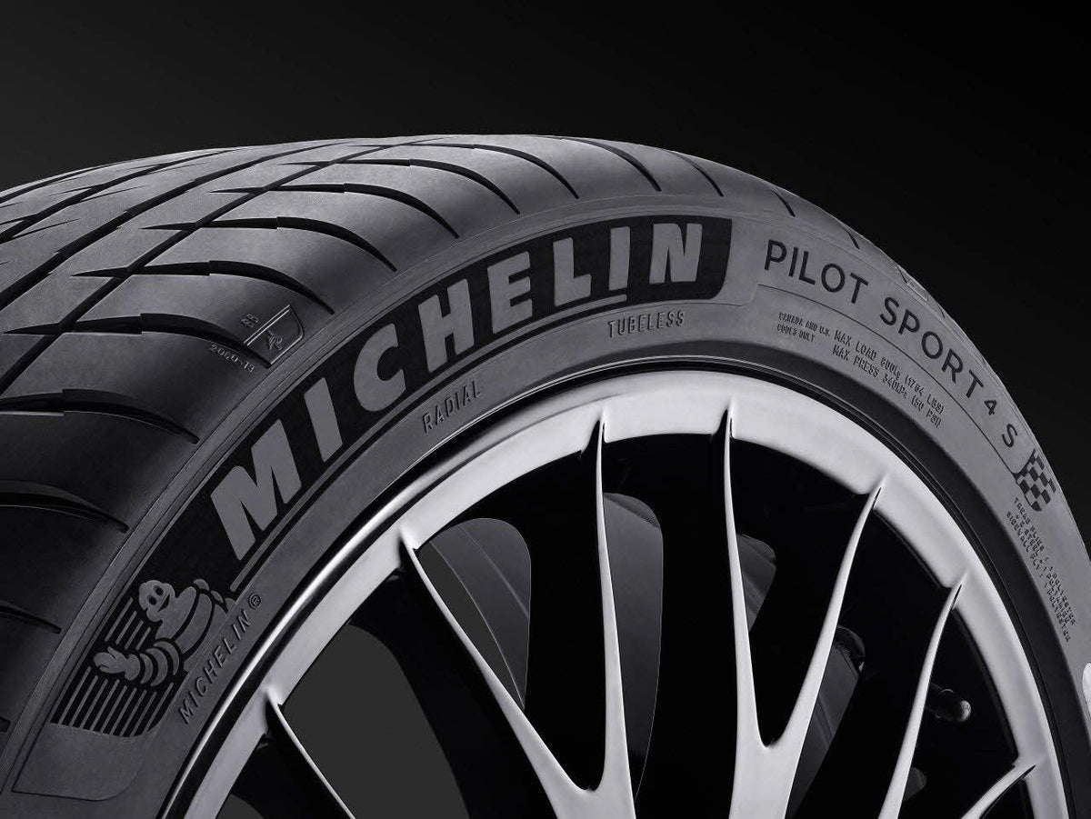Michelin Pilot Sport 4S sidewall and tread close-up on a black background