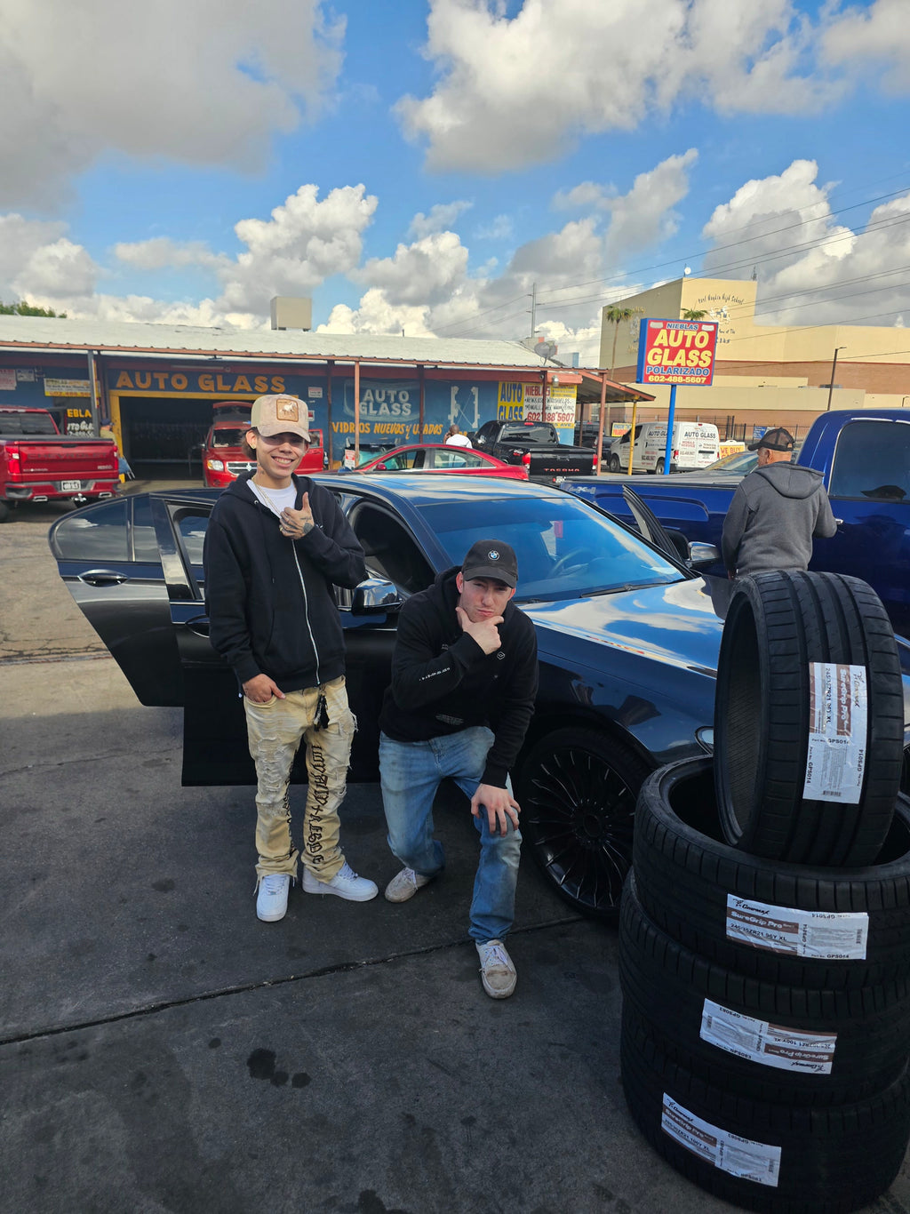Thermite Tactical customers in Phoenix with a set of Gripmax SureGrip Pro Sport tires, 245/35ZR21 and 265/30ZR21, beside their BMW